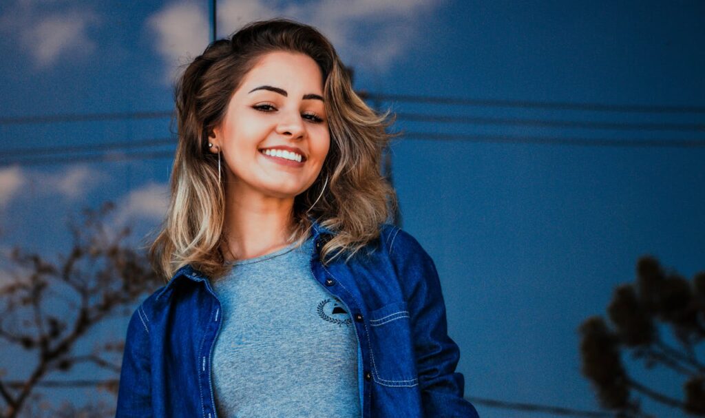 Woman Wearing Blue Shirt and Denim Jacket