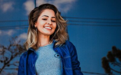 Woman Wearing Blue Shirt and Denim Jacket